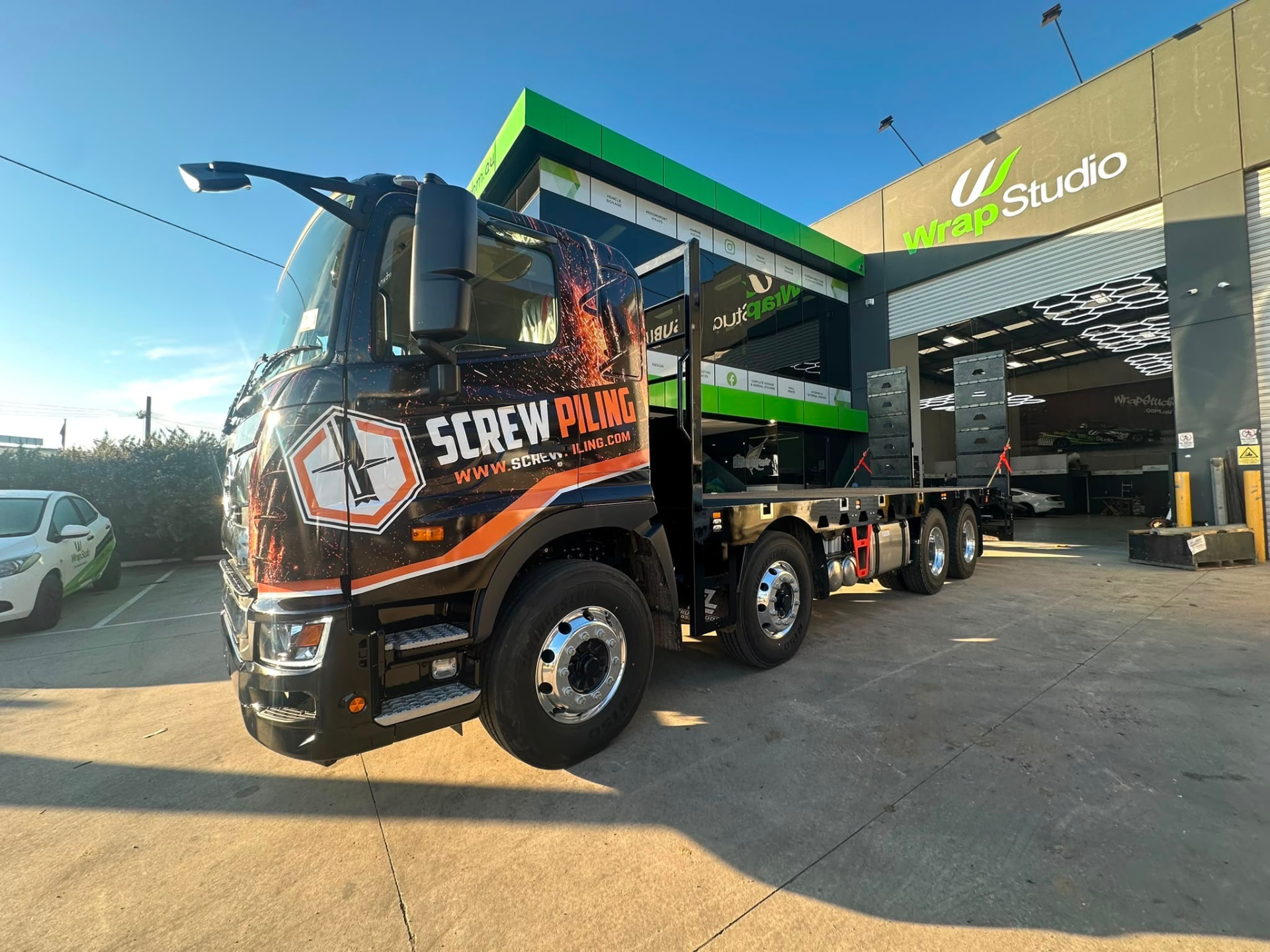 8x4 flat top tray truck delivered to Screw Piling