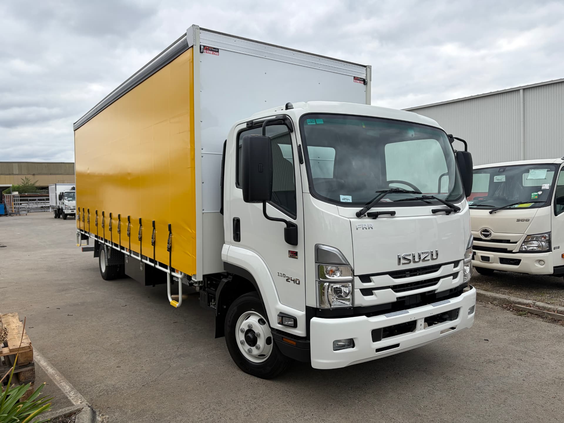 Isuzu FRR 110-240 curtain-sided tautliner delivered